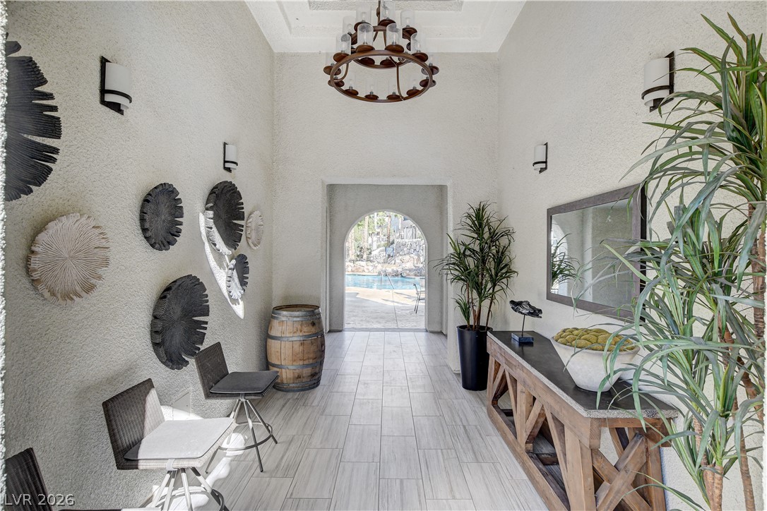 2555 Hampton Road, Unit 6108 Henderson, NV 89052 - Photo 58 of 63 Entrance foyer featuring hanging lights, a high ceiling, and a textured wall