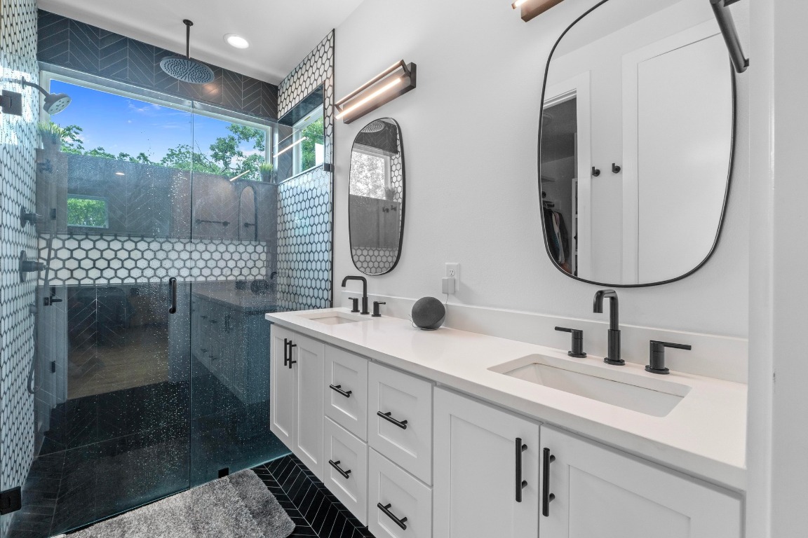 1023 East 45th Street, Unit 1 Austin, TX 78751 - Photo 16 of 30 a bathroom with a double vanity sink and a mirror