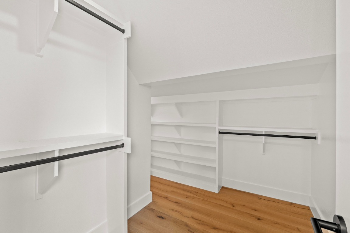 1023 East 45th Street, Unit 1 Austin, TX 78751 - Photo 17 of 30 a view of walk in closet with empty racks