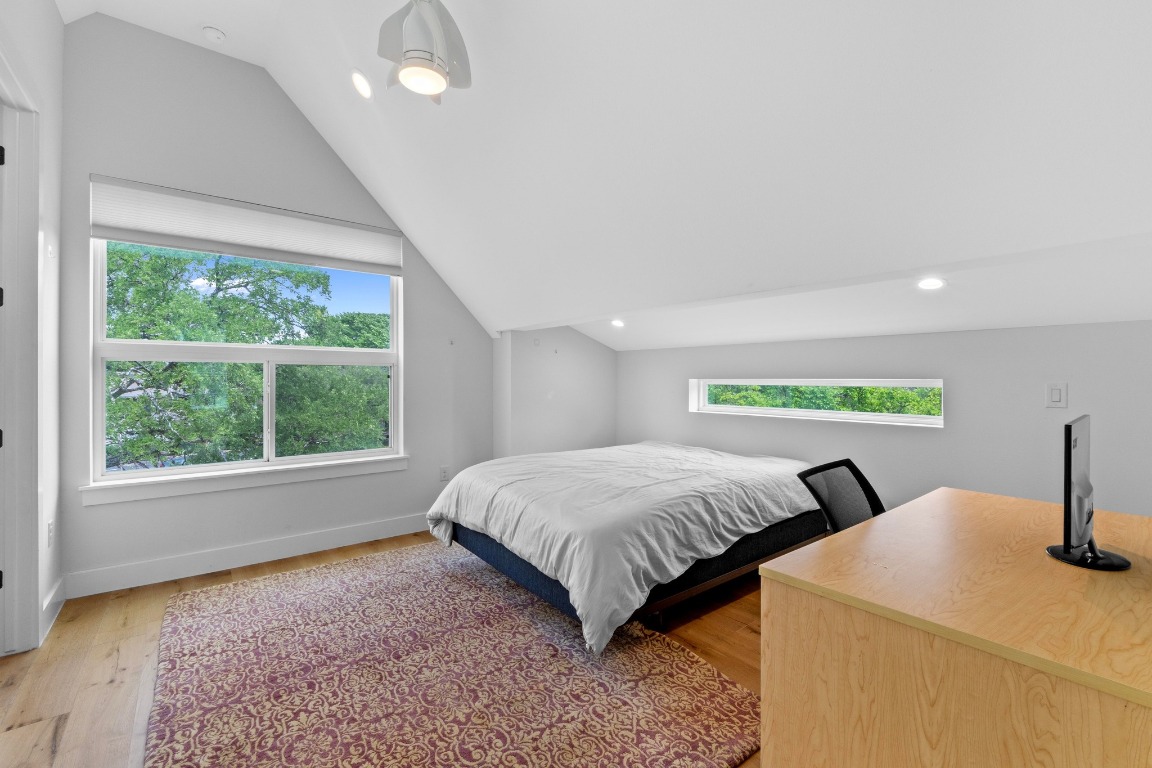 1023 East 45th Street, Unit 1 Austin, TX 78751 - Photo 22 of 30 a spacious bedroom with two beds and a large window
