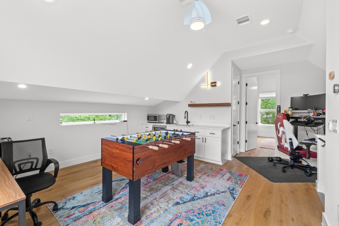 1023 East 45th Street, Unit 1 Austin, TX 78751 - Photo 24 of 30 a living room with furniture and a wooden floor