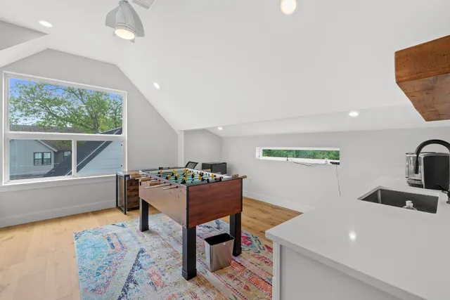 a terrace of a house with wooden floor and seating space