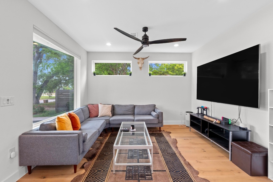 1023 East 45th Street, Unit 1 Austin, TX 78751 - Photo 4 of 30 a living room with furniture and a flat screen tv