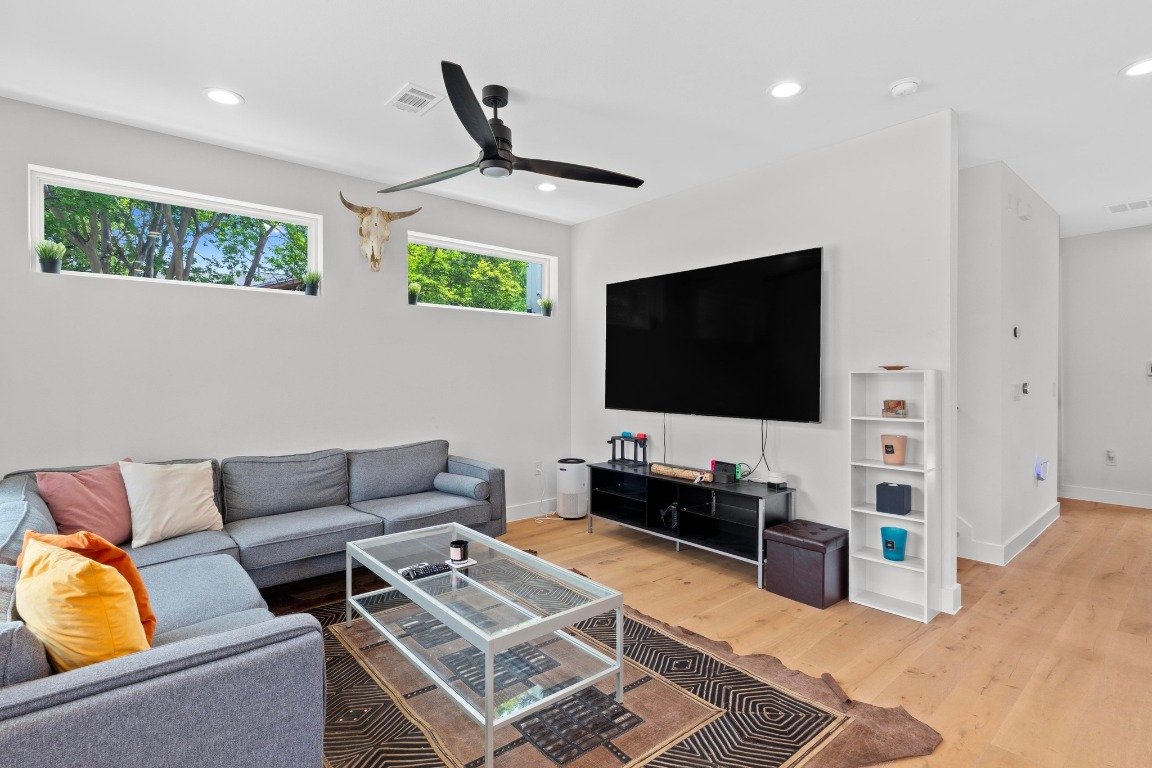 1023 East 45th Street, Unit 1 Austin, TX 78751 - Photo 5 of 30 a living room with furniture and a flat screen tv