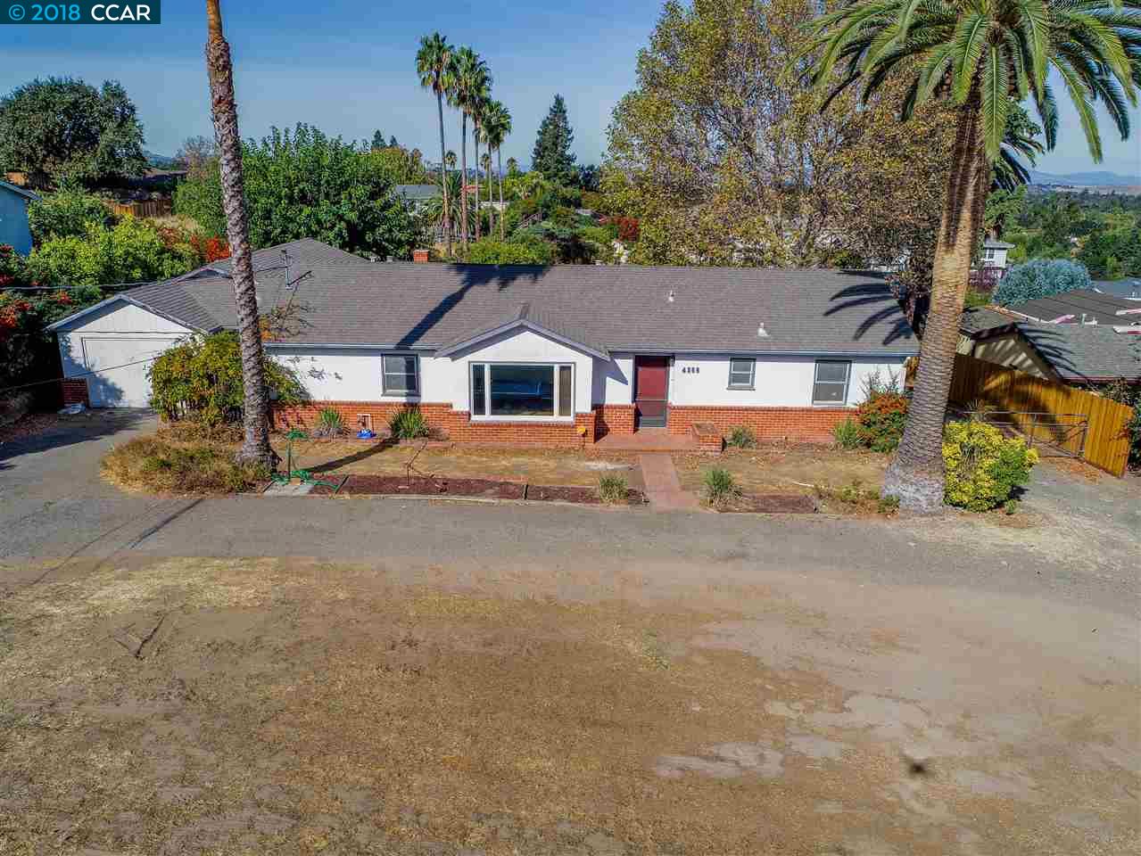 front view of a house with a street