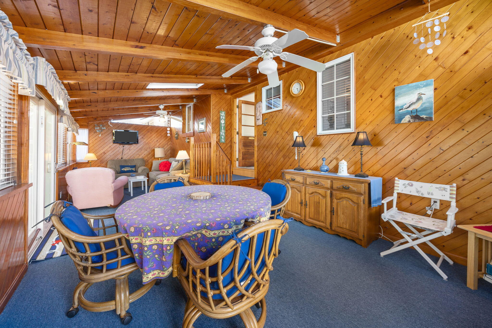 91 Wickertree Road North Falmouth, MA 02556 - Photo 20 of 40 a dining room with furniture and a chandelier