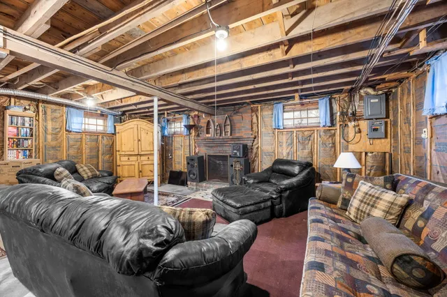 a outdoor living space with furniture and a fireplace