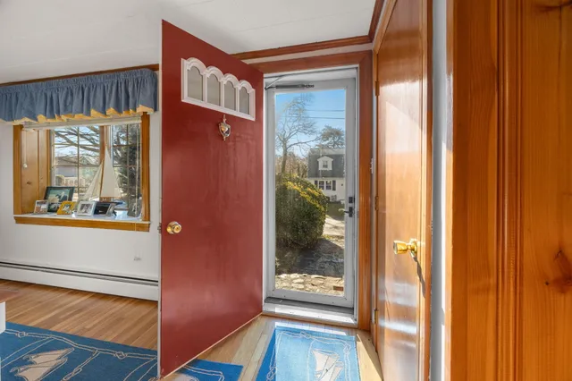 a view of a front door and bedroom