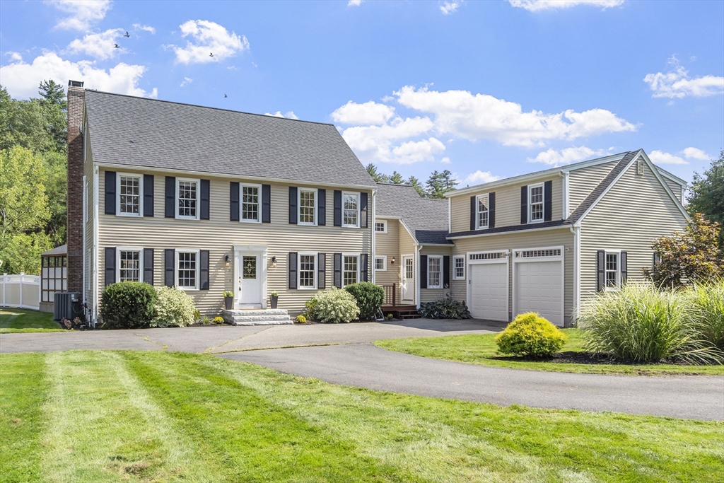 51 Still River Road Bolton, MA 01740 - Photo 1 of 41 a front view of a house with a yard