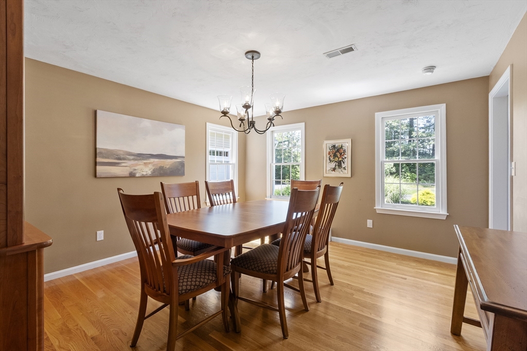 51 Still River Road Bolton, MA 01740 - Photo 14 of 41 a view of a dining room with furniture window and wooden floor