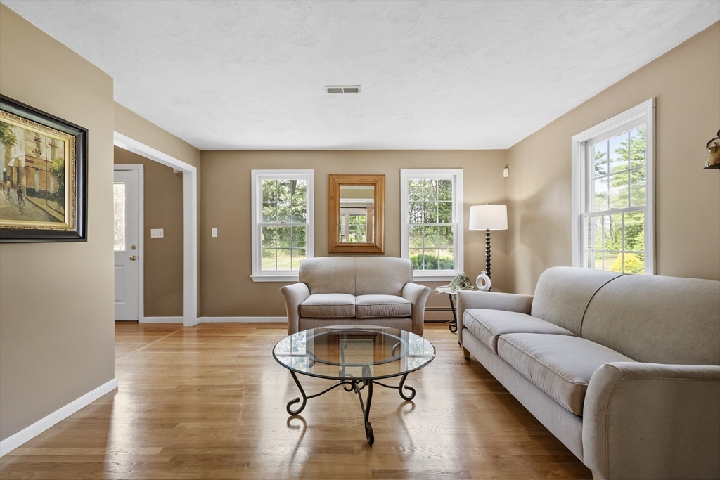 51 Still River Road Bolton, MA 01740 - Photo 15 of 41 a living room with furniture and a large window