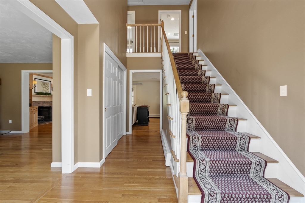 51 Still River Road Bolton, MA 01740 - Photo 18 of 41 a view of entryway and hall with wooden floor