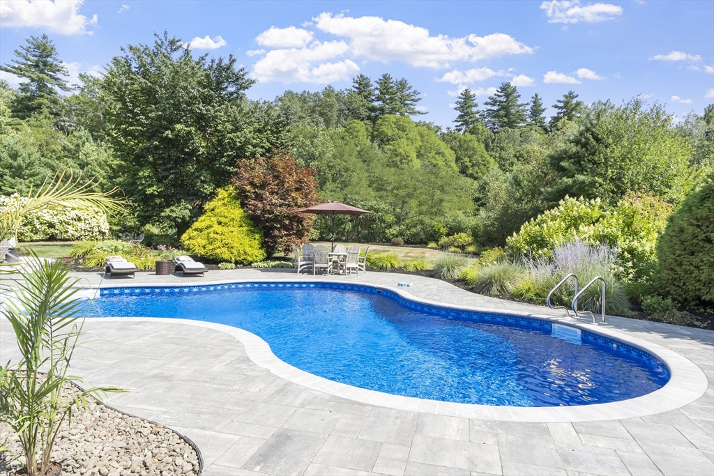 51 Still River Road Bolton, MA 01740 - Photo 2 of 41 a view of a swimming pool with a yard
