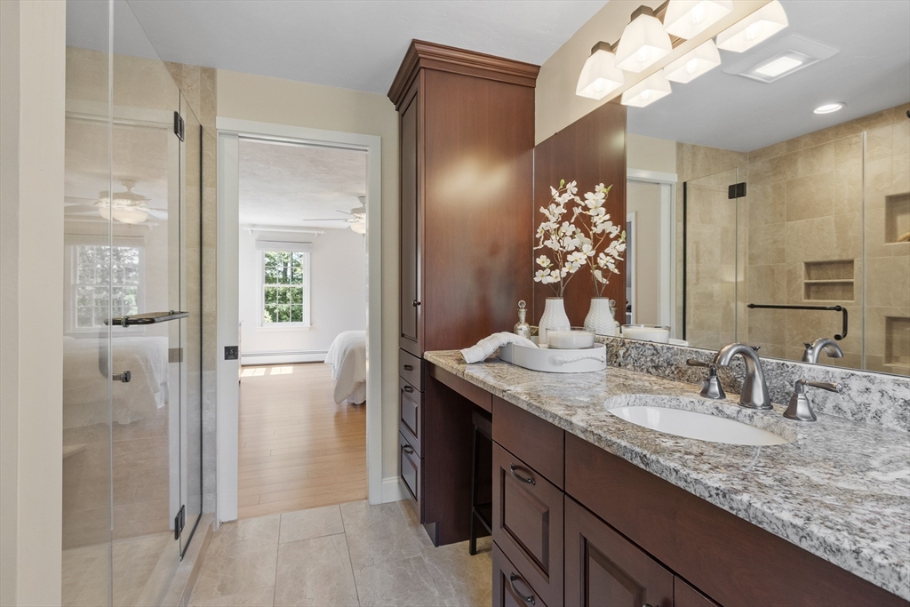 51 Still River Road Bolton, MA 01740 - Photo 21 of 41 a bathroom with a granite countertop sink a large mirror and a shower