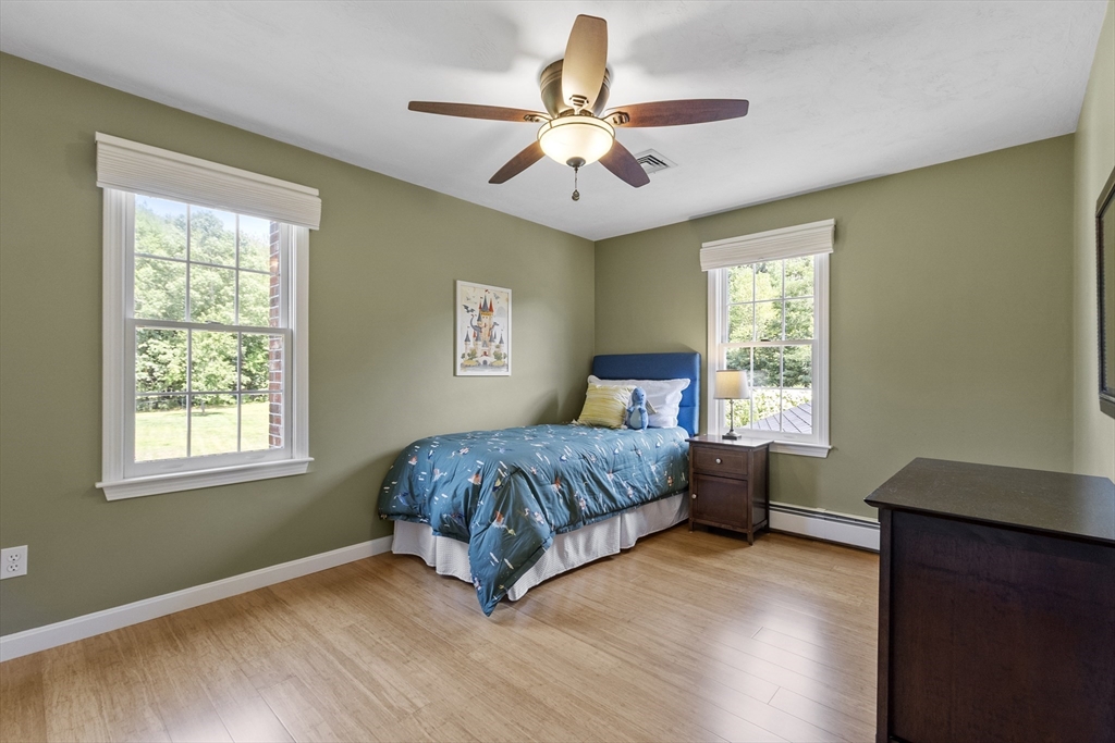 51 Still River Road Bolton, MA 01740 - Photo 24 of 41 a bedroom with a bed and a window