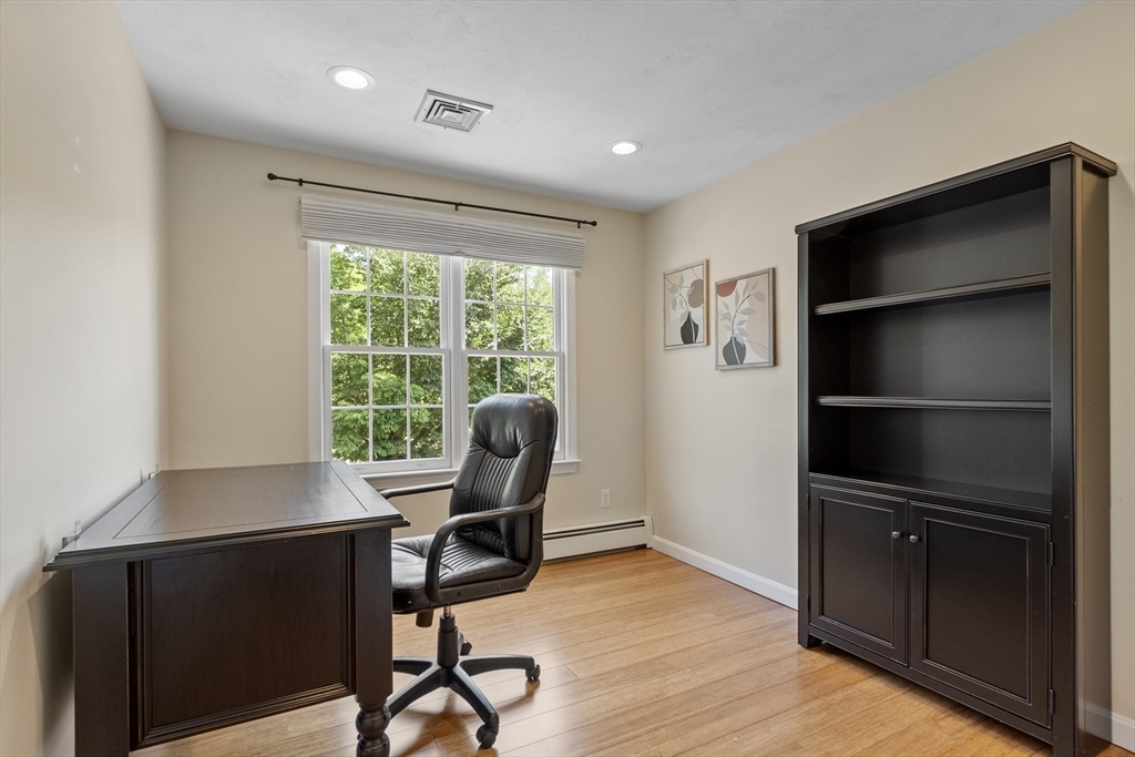 51 Still River Road Bolton, MA 01740 - Photo 25 of 41 a view of a workspace with furniture and a window