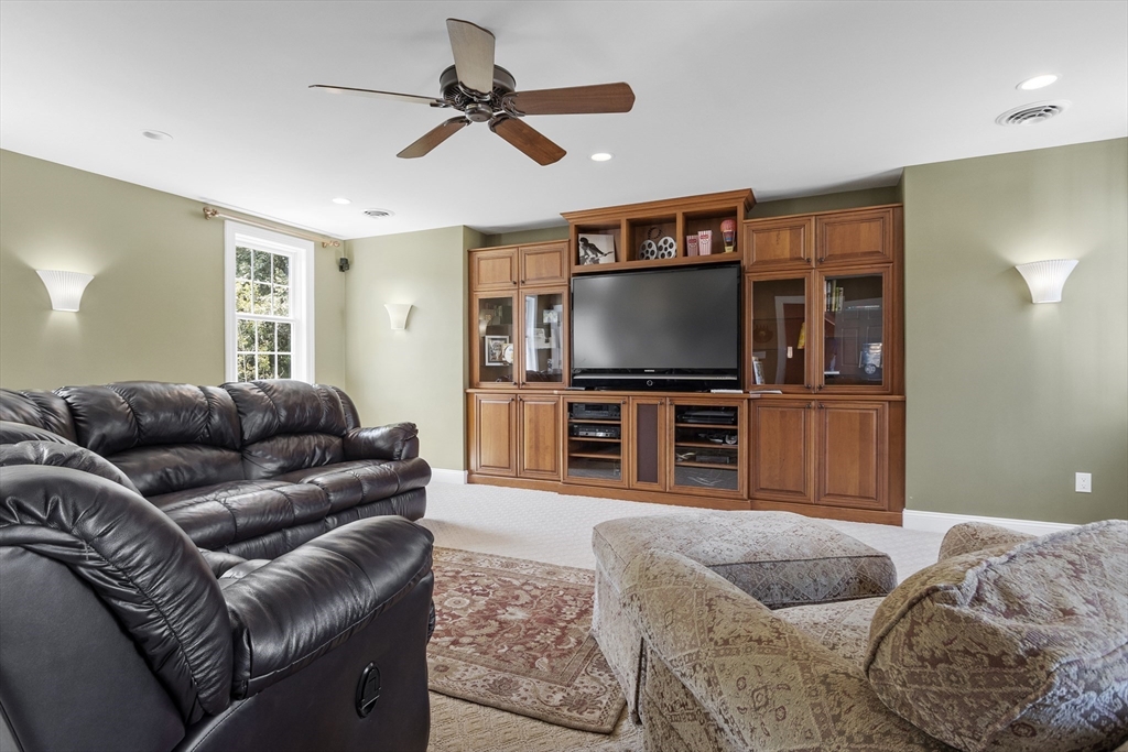 51 Still River Road Bolton, MA 01740 - Photo 28 of 41 a living room with furniture and a flat screen tv