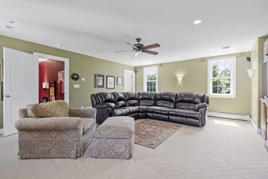 51 Still River Road Bolton, MA 01740 - Photo 29 of 41 a living room with furniture and a ceiling fan