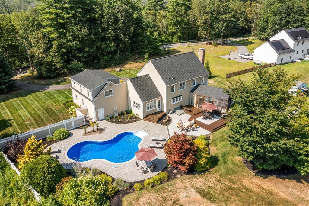 51 Still River Road Bolton, MA 01740 - Photo 3 of 41 an aerial view of a house with outdoor space