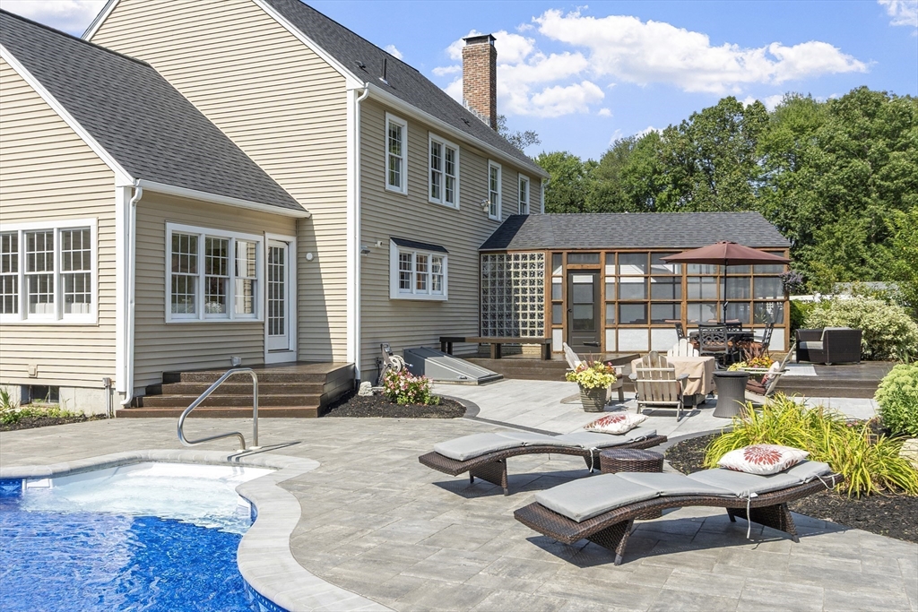 51 Still River Road Bolton, MA 01740 - Photo 35 of 41 a backyard of a house with outdoor seating