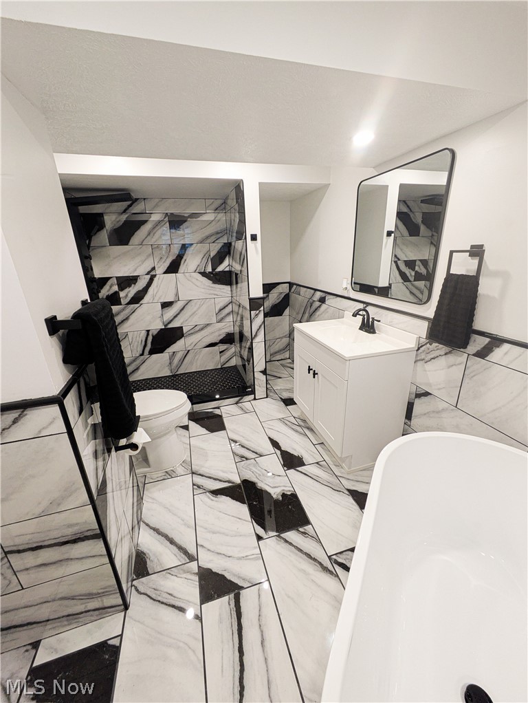 3554 Ludgate Road Shaker Heights, OH 44120 - Photo 45 of 50 Bathroom on the lower level featuring Black and White patterned tile flooring and wall accents