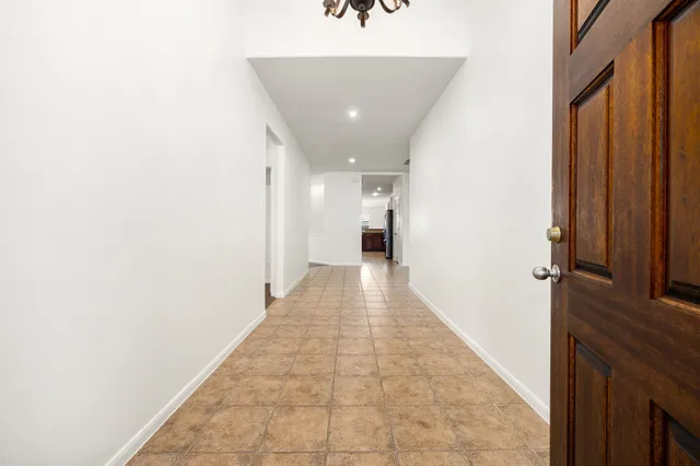 a kitchen with stainless steel appliances granite countertop a stove sink and cabinets