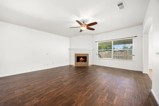 a large kitchen with stainless steel appliances granite countertop a stove sink and cabinets