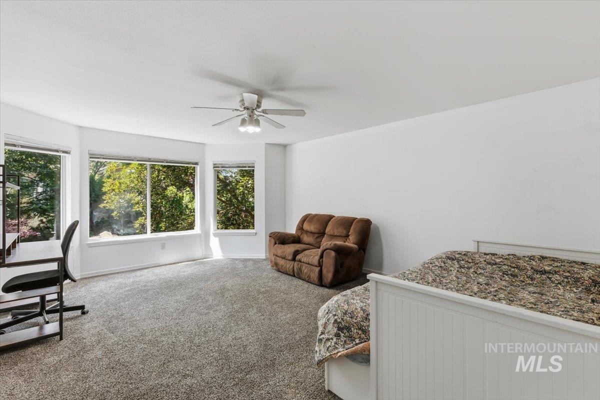 8001 West Innsbrook Court Boise, ID 83704 - Photo 24 of 39 Spacious room with plush gray carpeting and white walls