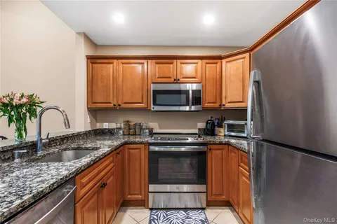 a kitchen with a sink stove and microwave