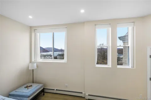 a view of room with window and hardwood floor
