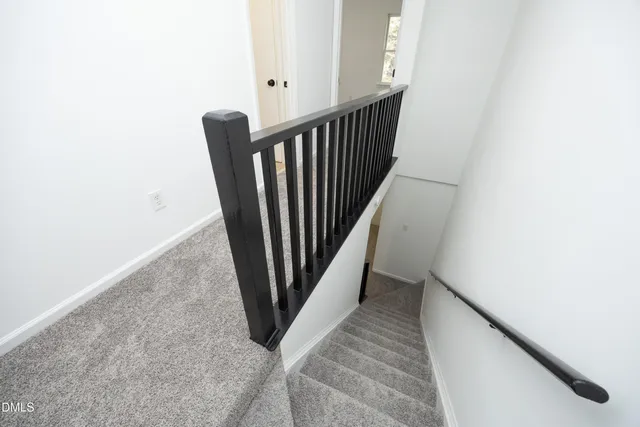 a view of a hallway with staircase