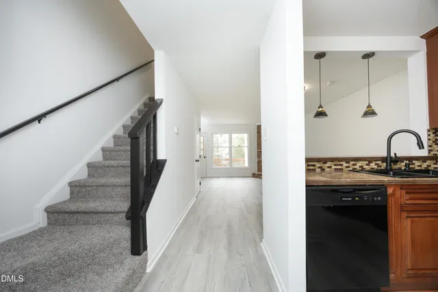 a view of a kitchen from the hallway