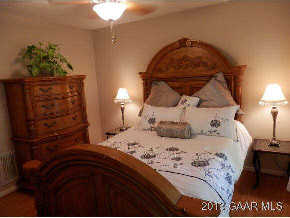 2198 Lyndhurst Road Waynesboro, VA 22980 - Photo 13 of 27 a bedroom with a bed and a potted plant