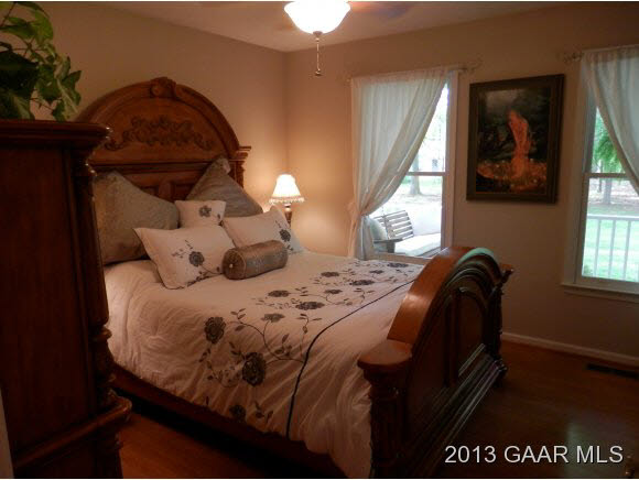 2198 Lyndhurst Road Waynesboro, VA 22980 - Photo 14 of 27 a bed sitting in a bedroom next to a window