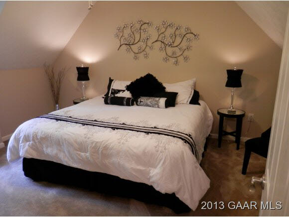 2198 Lyndhurst Road Waynesboro, VA 22980 - Photo 4 of 27 a bedroom with a bed and a painting on the wall