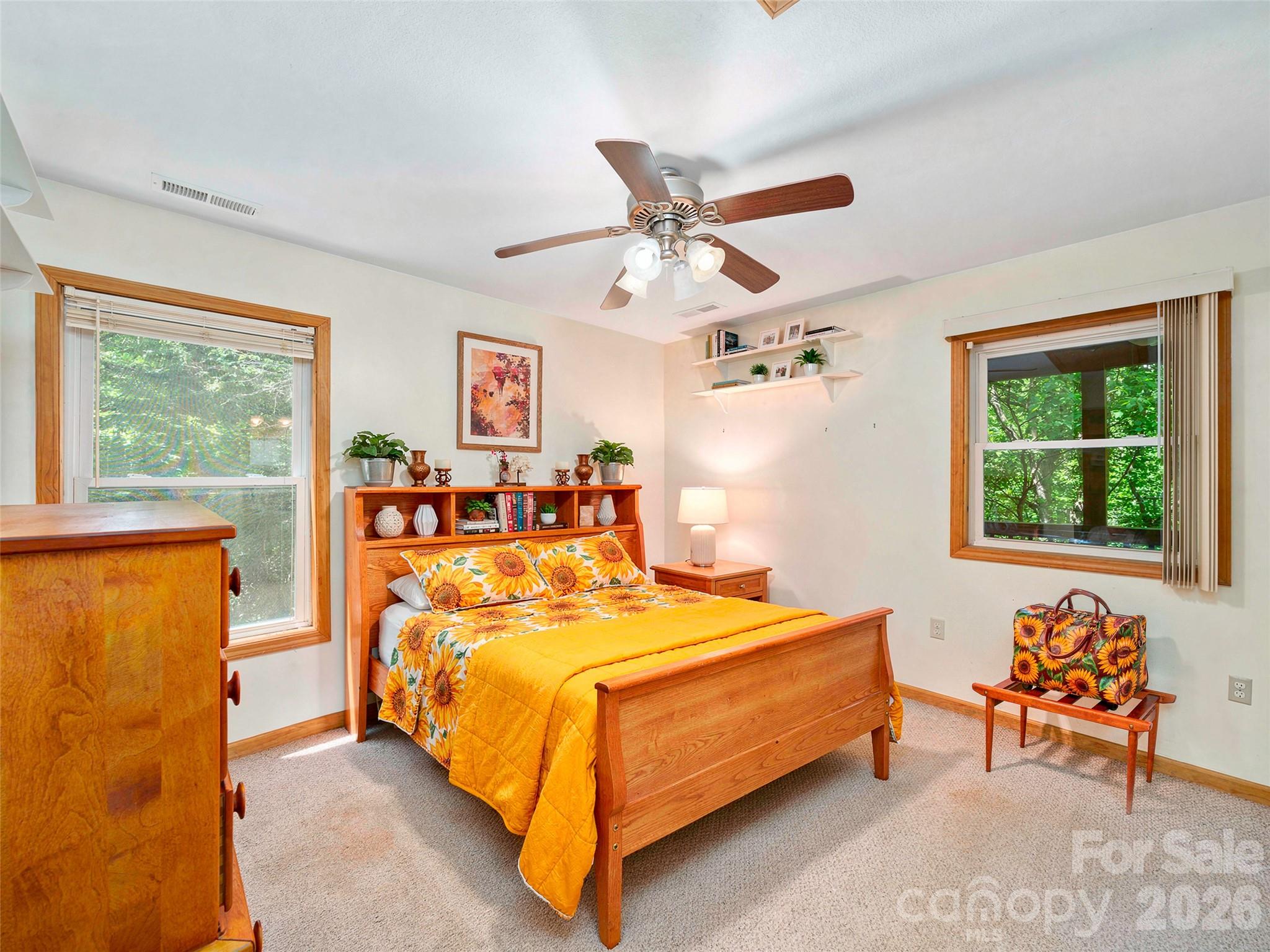 142 Wildflower Road Spruce Pine, NC 28777 - Photo 13 of 46 a bedroom with a bed and a window