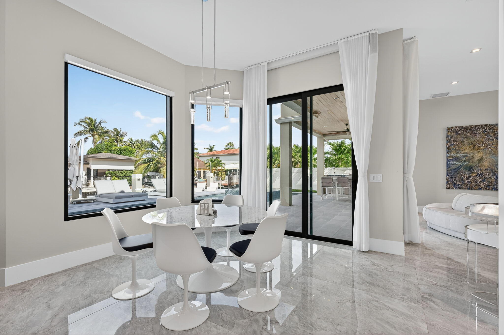 785 Northeast 70th Street Boca Raton, FL 33487 - Photo 17 of 80 a living room with furniture and a large window