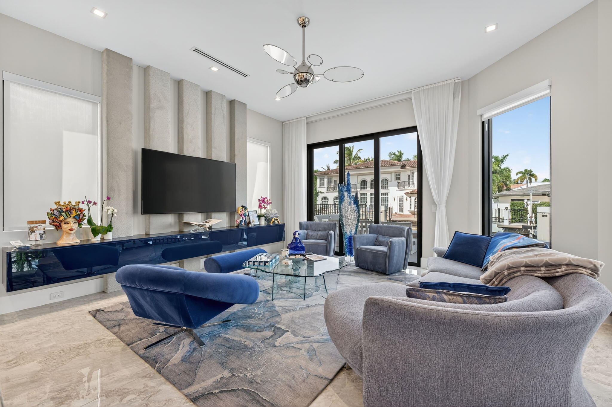 785 Northeast 70th Street Boca Raton, FL 33487 - Photo 18 of 80 a living room with furniture and a flat screen tv