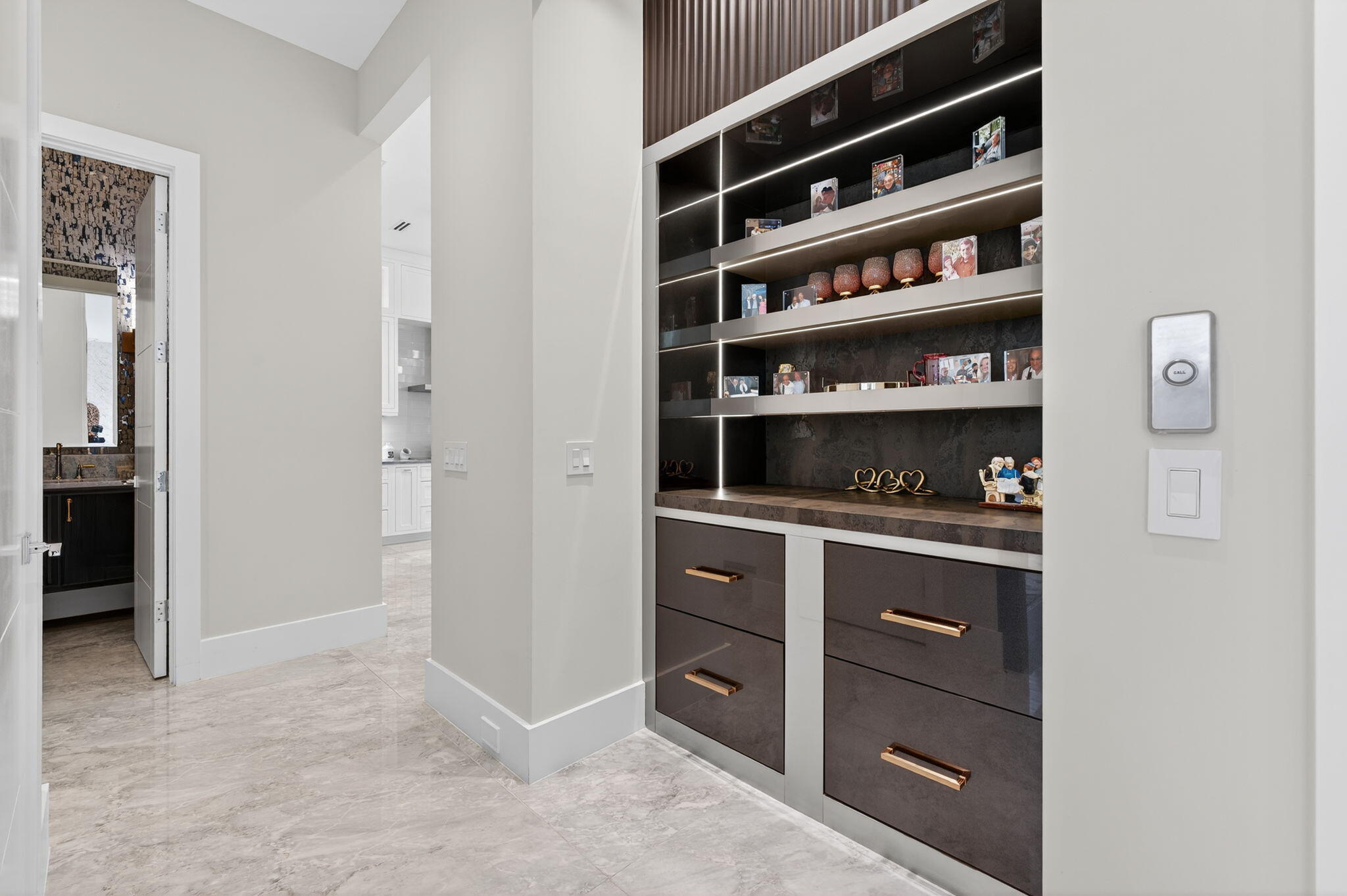785 Northeast 70th Street Boca Raton, FL 33487 - Photo 28 of 80 a kitchen with a wooden floor and cabinets