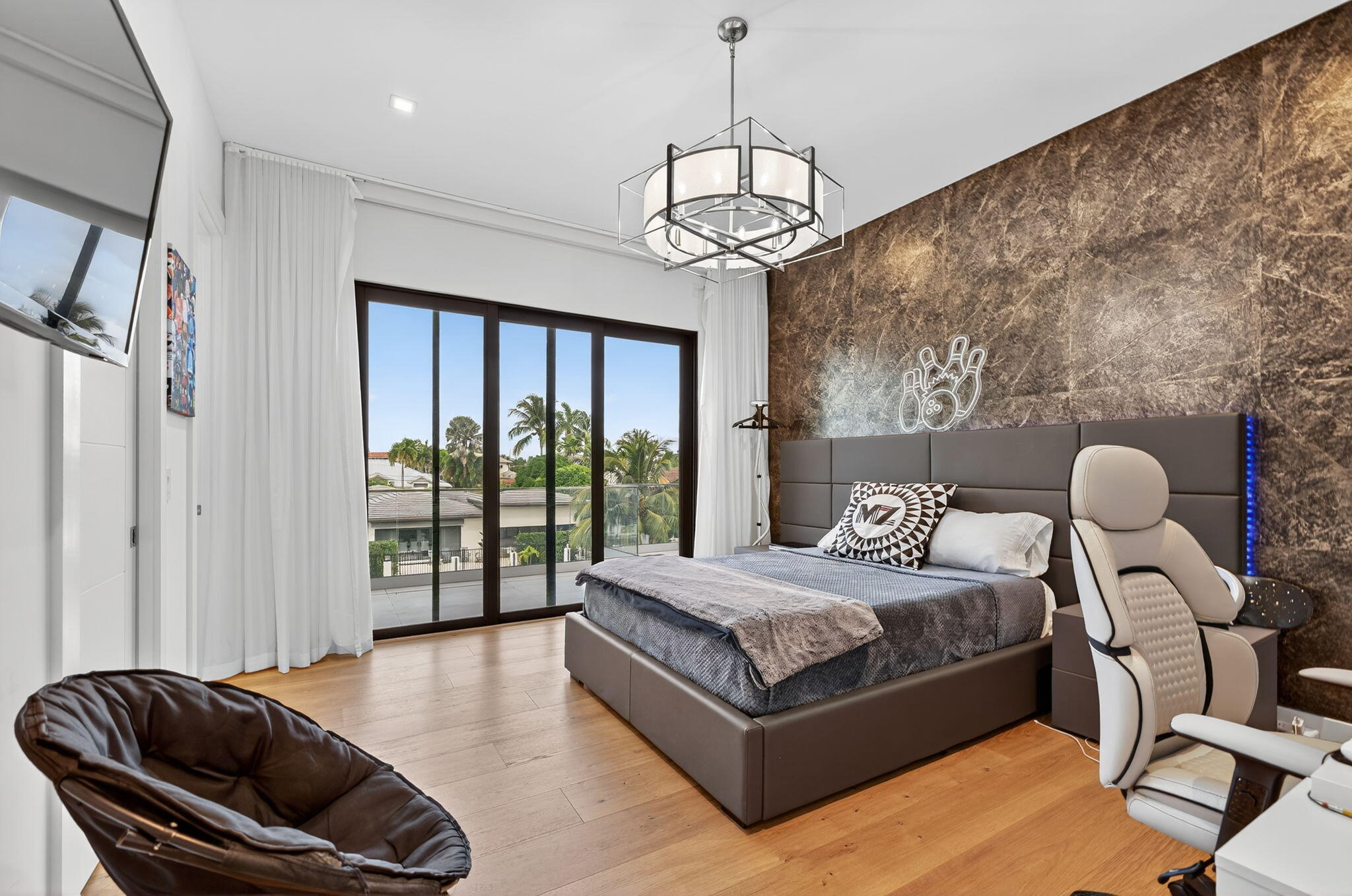 785 Northeast 70th Street Boca Raton, FL 33487 - Photo 49 of 80 a bedroom with a bed and wooden floor