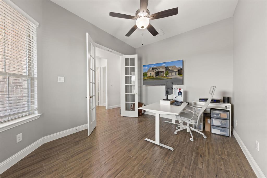 8808 Royal Star Road Rowlett, TX 75089 - Photo 16 of 40 a workspace with wooden floor