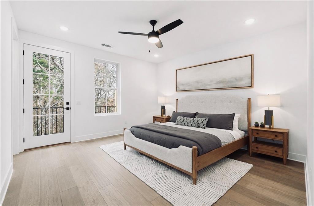 531 South Main Street, Unit 320 Alpharetta, GA 30009 - Photo 13 of 43 a bedroom with a large bed and a window