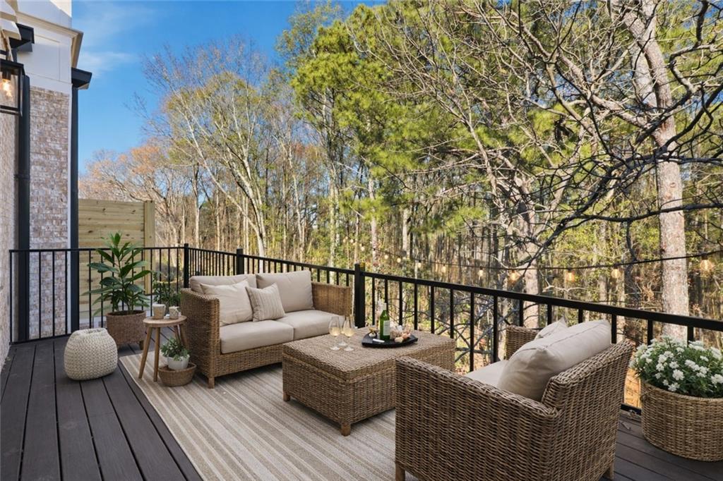 531 South Main Street, Unit 320 Alpharetta, GA 30009 - Photo 14 of 43 a balcony with wooden floor and with couches