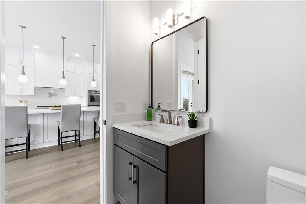 531 South Main Street, Unit 320 Alpharetta, GA 30009 - Photo 22 of 43 a bathroom with a sink vanity and a mirror
