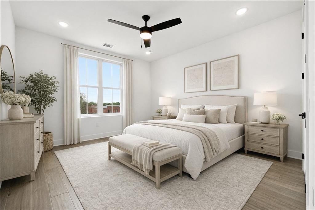 531 South Main Street, Unit 320 Alpharetta, GA 30009 - Photo 23 of 43 a spacious bedroom with a bed and a window