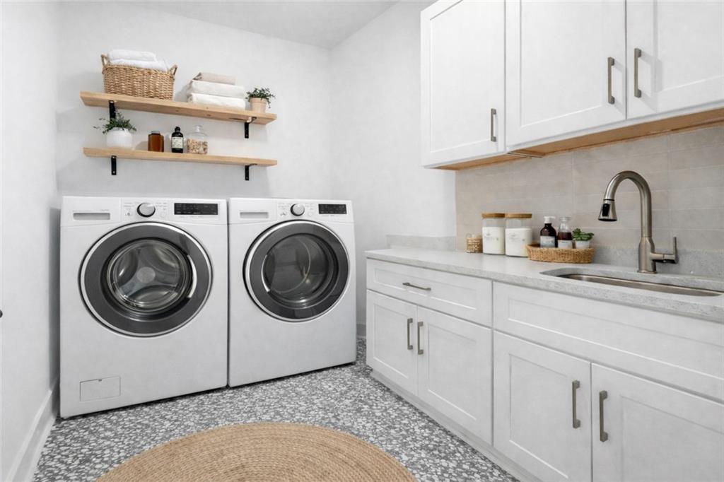 531 South Main Street, Unit 320 Alpharetta, GA 30009 - Photo 27 of 43 a utility room with sink dryer and washer