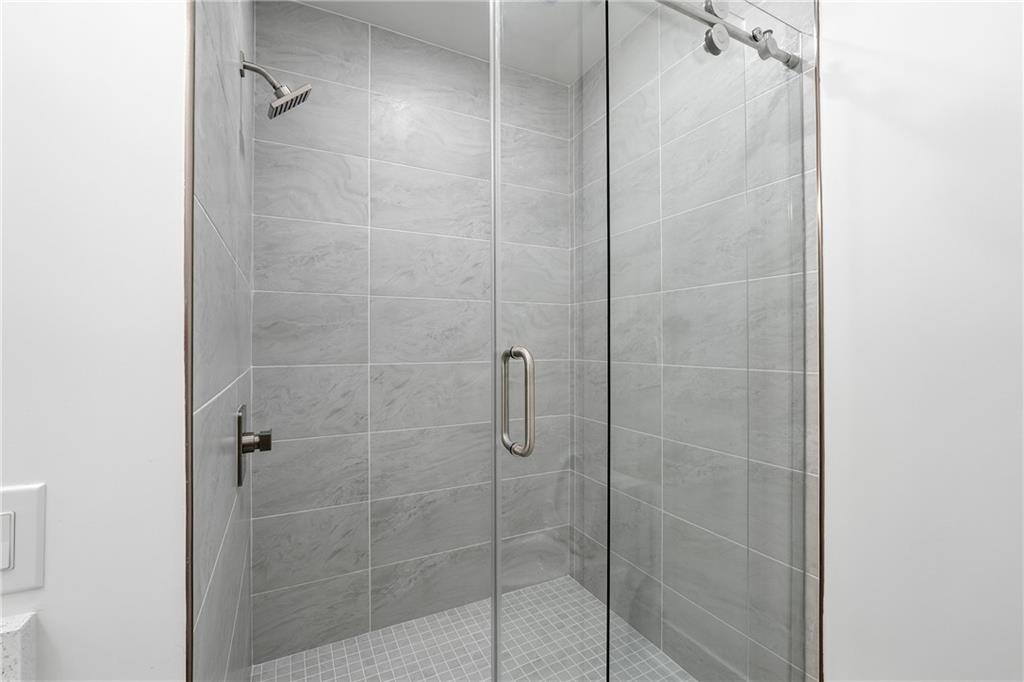 531 South Main Street, Unit 320 Alpharetta, GA 30009 - Photo 31 of 43 a bathroom with a shower