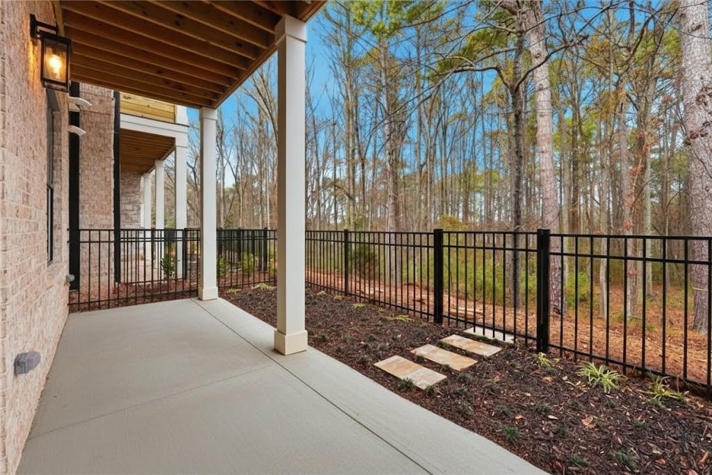 531 South Main Street, Unit 320 Alpharetta, GA 30009 - Photo 33 of 43 a view of a backyard with iron fence