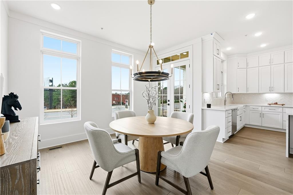 531 South Main Street, Unit 320 Alpharetta, GA 30009 - Photo 10 of 43 a dining room with furniture and window