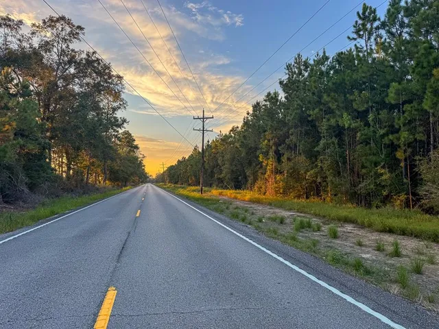a view of a yard and basketball court